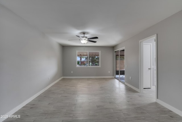 empty room featuring ceiling fan, baseboards, and light wood-style flooring