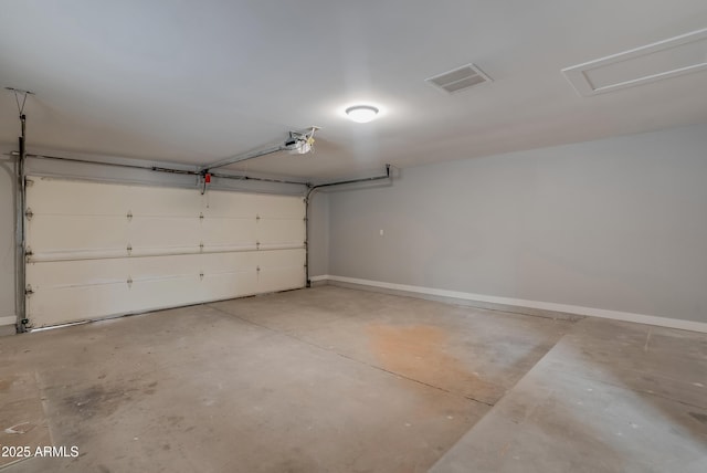 garage with visible vents and baseboards