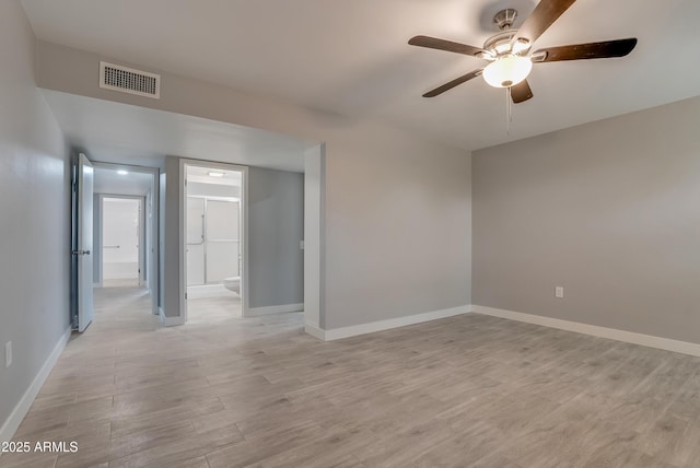 unfurnished room with a ceiling fan, baseboards, visible vents, and light wood finished floors