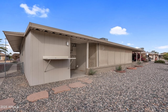 back of property with fence