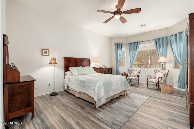 bedroom with hardwood / wood-style flooring and ceiling fan