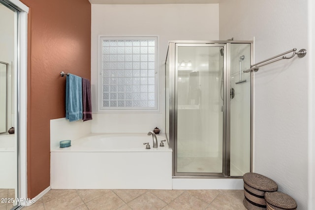 bathroom featuring independent shower and bath and tile patterned flooring