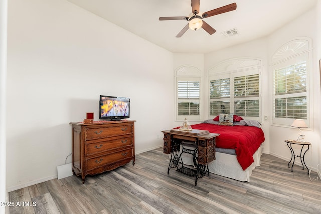 bedroom featuring wood-type flooring and ceiling fan