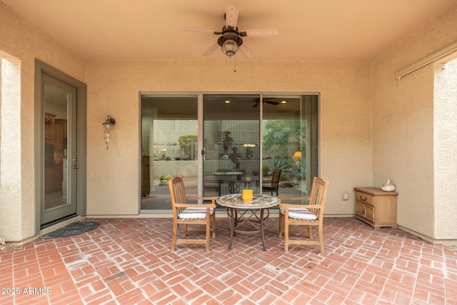 view of patio featuring ceiling fan