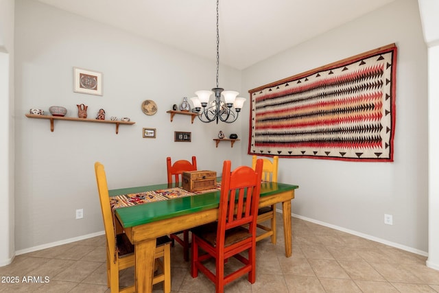 tiled dining space featuring an inviting chandelier and lofted ceiling