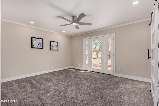 spare room with recessed lighting, carpet flooring, a ceiling fan, baseboards, and crown molding