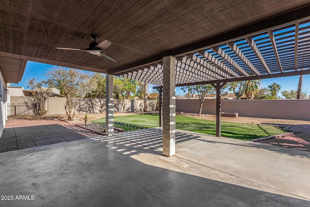 view of patio with a fenced backyard and a ceiling fan