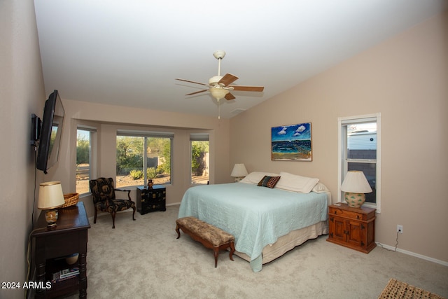 bedroom with vaulted ceiling, light carpet, and ceiling fan