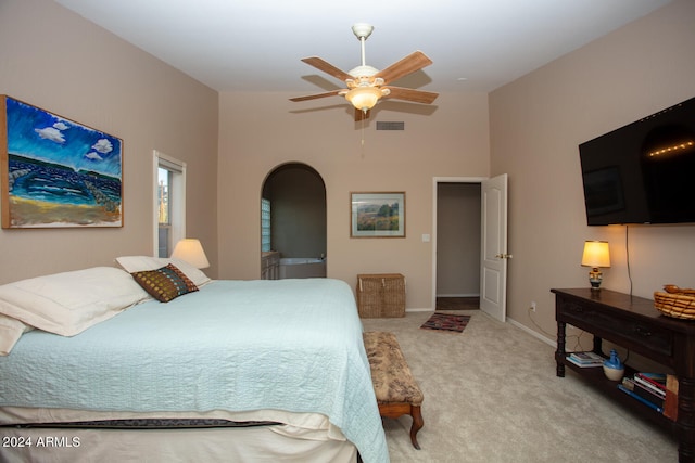 bedroom featuring light carpet and ceiling fan