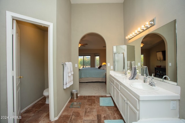 bathroom featuring ceiling fan, vanity, and toilet