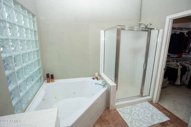 bathroom with separate shower and tub