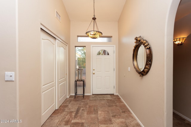 entrance foyer featuring lofted ceiling