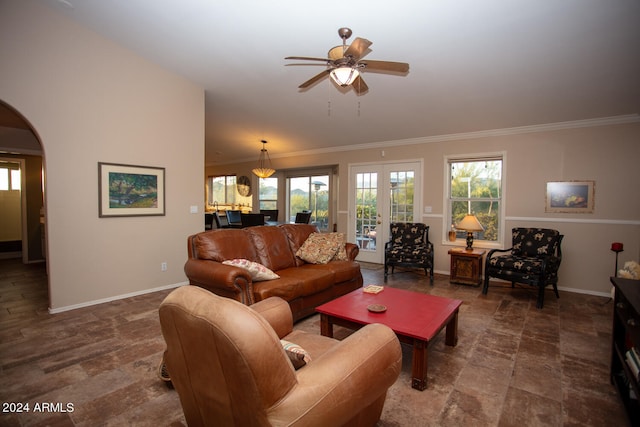 living room with ornamental molding and ceiling fan