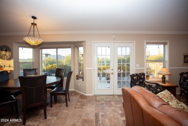 interior space with ornamental molding and french doors