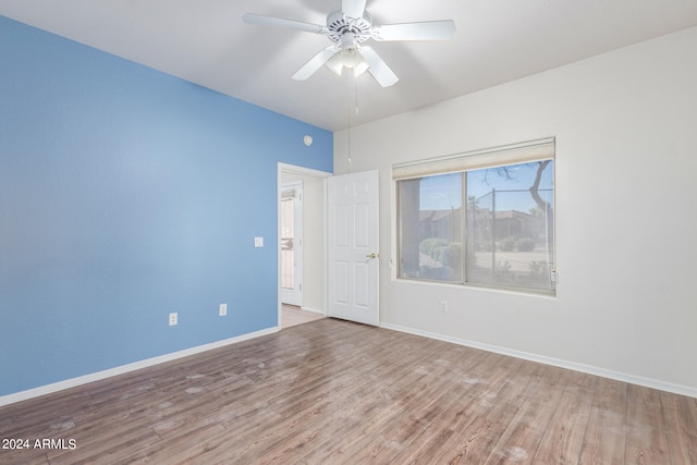 unfurnished room featuring ceiling fan and hardwood / wood-style flooring