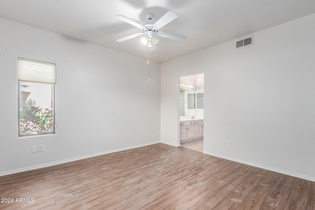 spare room with light hardwood / wood-style floors and ceiling fan