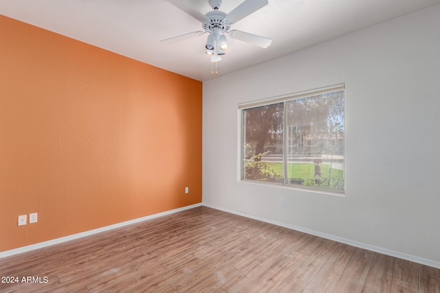 spare room featuring ceiling fan and light hardwood / wood-style floors