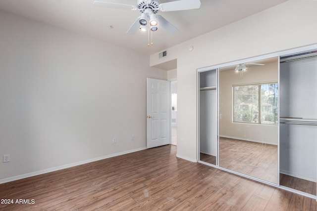 unfurnished bedroom featuring a closet, ceiling fan, and light wood-type flooring