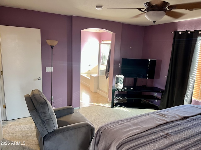 bedroom with ceiling fan and light carpet