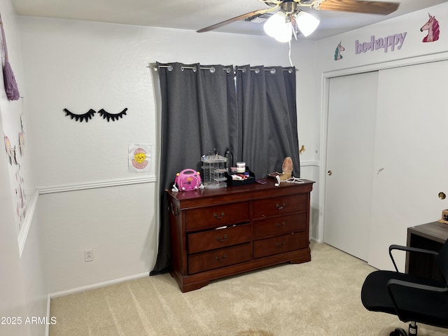 interior space with light carpet and ceiling fan