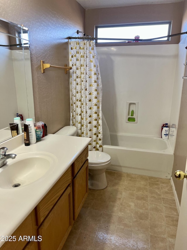 full bathroom with toilet, vanity, and shower / bath combo with shower curtain