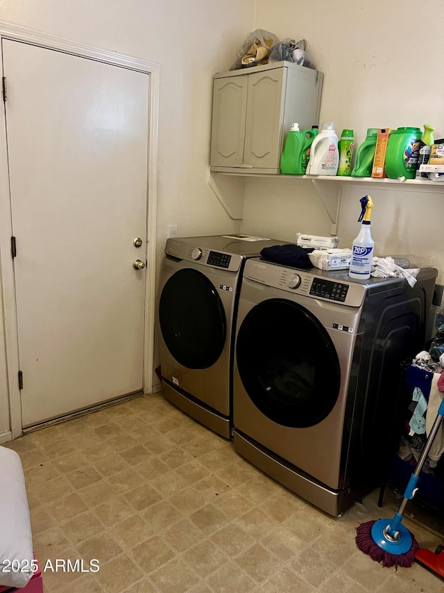 clothes washing area featuring washing machine and clothes dryer