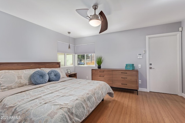 5210 W Jupiter Way N, Chandler, AZ 85226 - bedroom with light wood-type flooring and a ceiling fan