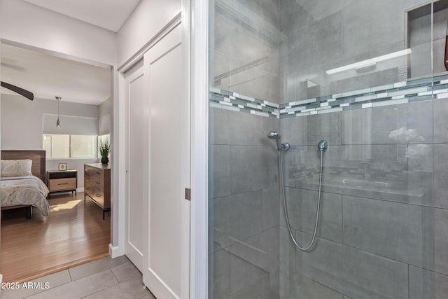 5210 W Jupiter Way N, Chandler, AZ 85226 - bathroom featuring a walk in shower, connected bathroom, tile patterned floors, and a ceiling fan