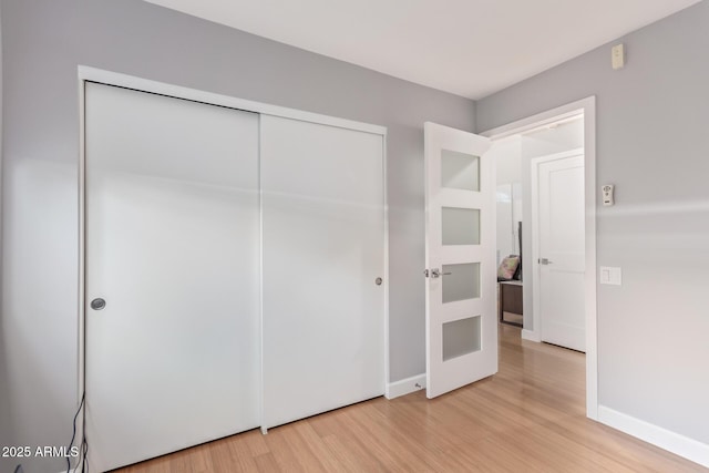 5210 W Jupiter Way N, Chandler, AZ 85226 - unfurnished bedroom featuring light wood-style flooring and a closet