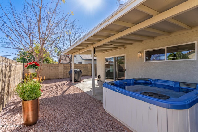 5210 W Jupiter Way N, Chandler, AZ 85226 - fenced backyard featuring a hot tub, grilling area, and a patio area
