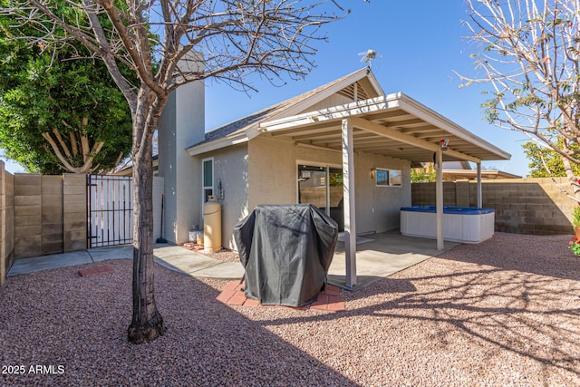 5210 W Jupiter Way N, Chandler, AZ 85226 - back of property with a gate, stucco siding, and a patio