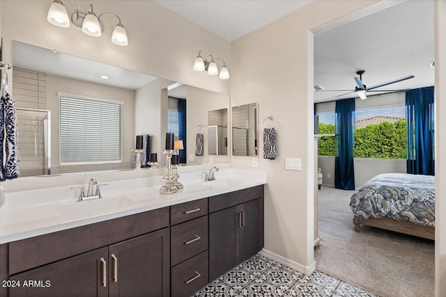 bathroom with tile patterned floors, ceiling fan, vanity, and a shower with shower door