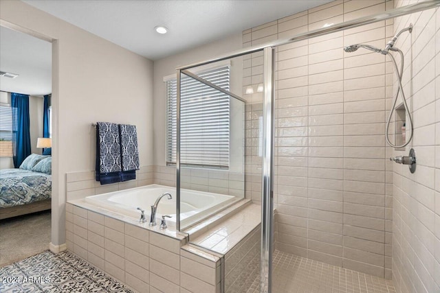 bathroom featuring shower with separate bathtub and tile patterned floors