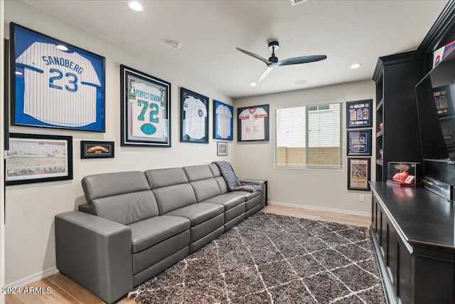 living room with dark hardwood / wood-style floors and ceiling fan