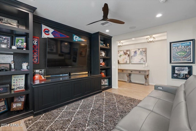 living room with hardwood / wood-style flooring and ceiling fan