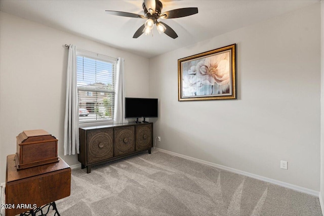 bedroom featuring ceiling fan and light carpet