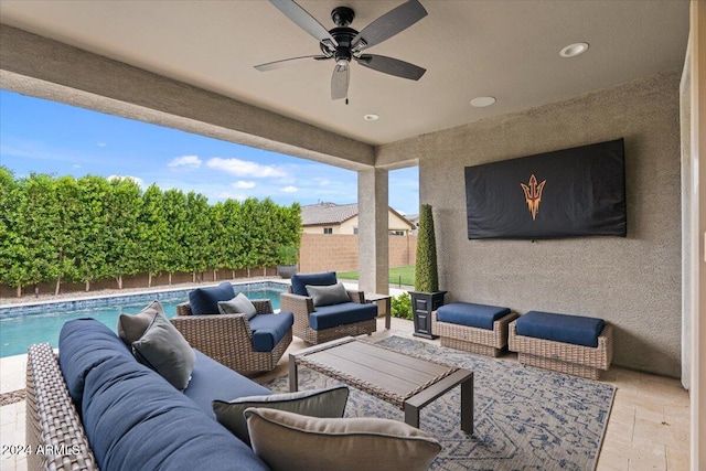 view of patio featuring a fenced in pool, outdoor lounge area, and ceiling fan