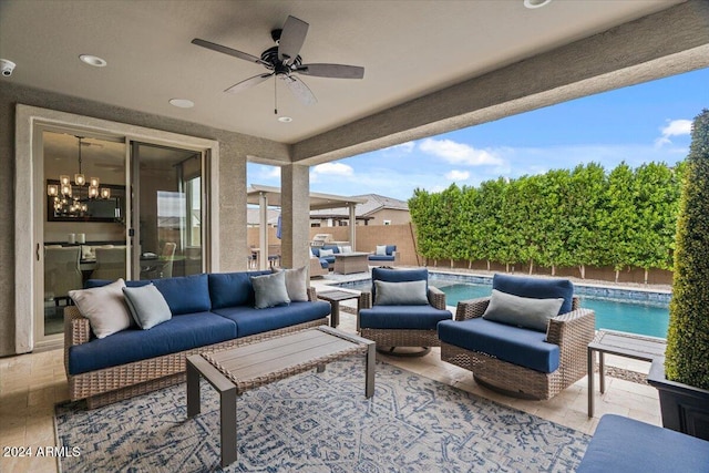 view of patio with a fenced in pool, an outdoor living space, and ceiling fan