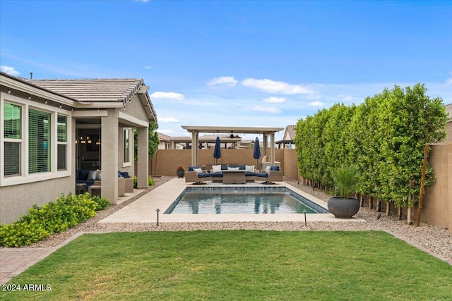 view of pool with a yard, an outdoor living space, a patio area, and a pergola