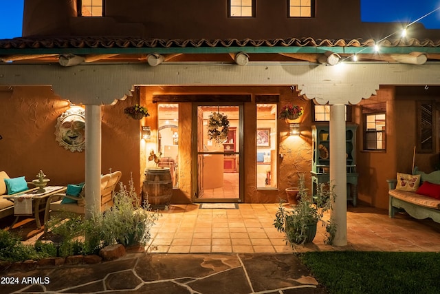 doorway to property with a patio area