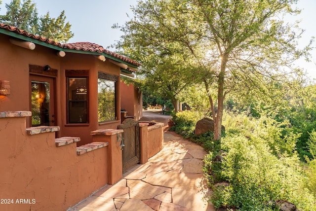 view of property exterior featuring a patio area