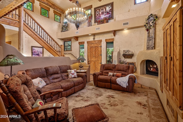 living room featuring a high ceiling and an inviting chandelier