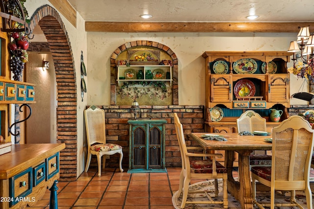 dining space with tile patterned floors