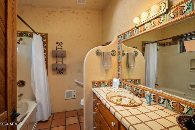 full bathroom featuring tile patterned floors, vanity, toilet, and shower / tub combo with curtain