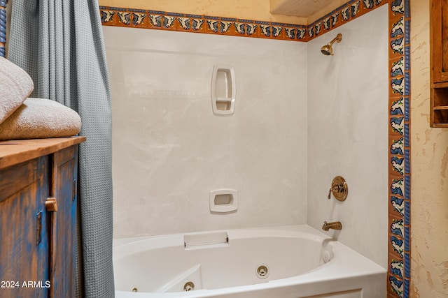 bathroom featuring shower / tub combo with curtain