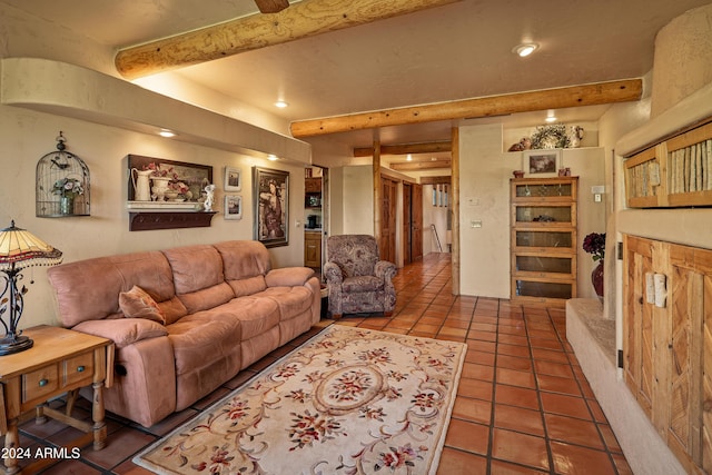 tiled living room featuring beamed ceiling