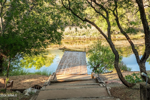 view of community with a water view