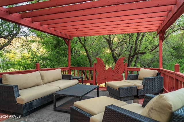 wooden terrace featuring a pergola and an outdoor living space