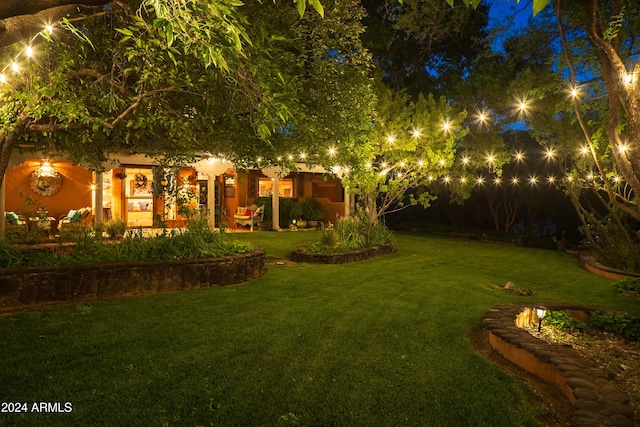 view of yard at twilight