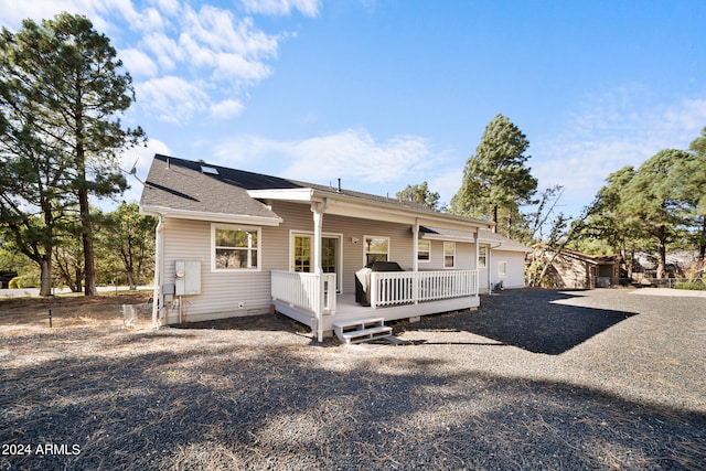 view of front of house featuring a wooden deck